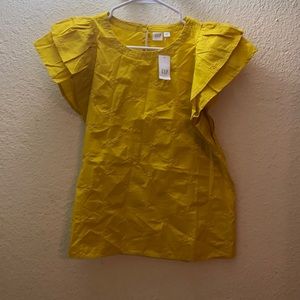 Yellow shirt with small flowers embroidered